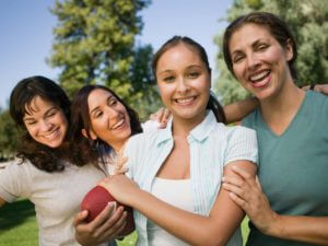 Group Of Girls With Smiling Face And Holding A Basketball 