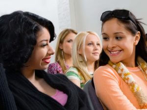 Girls Interacting Each Other With Smiling Face